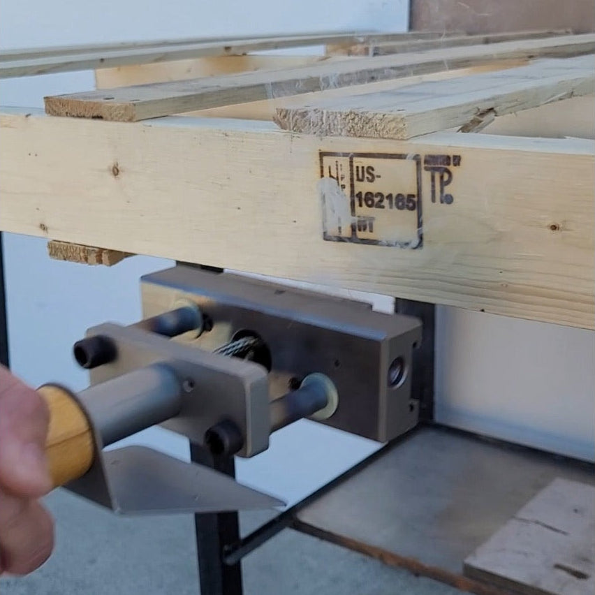 Wooden pallet being branded with ISPM15 IPPC Heat Treat Stamp